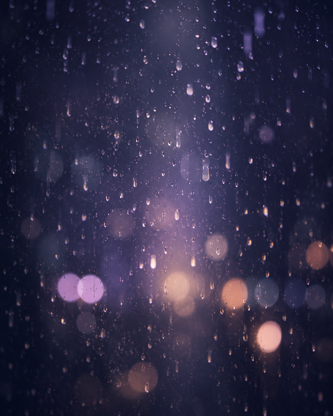 Rain on a window at night